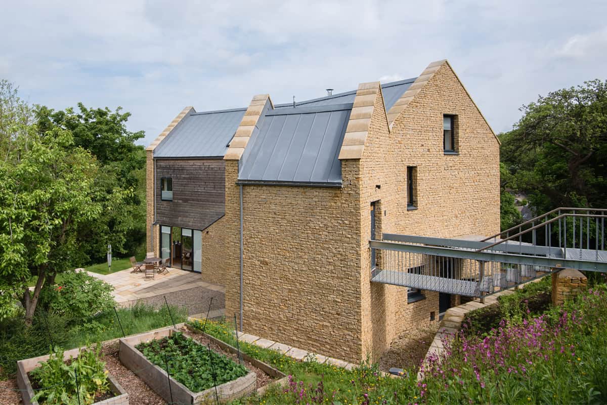 Harleywood House exterior view showing Cotswold stone, zinc roof and garden raised beds